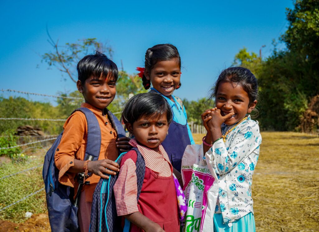 Smiling children enjoying a sunny day in Lonavala, Maharashtra, India.